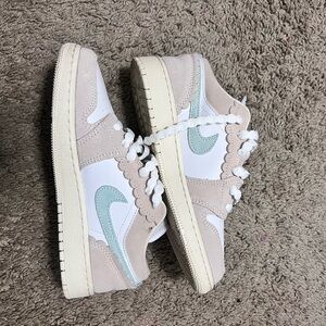 Stylish Beige and White Sneakers with Blue Accents